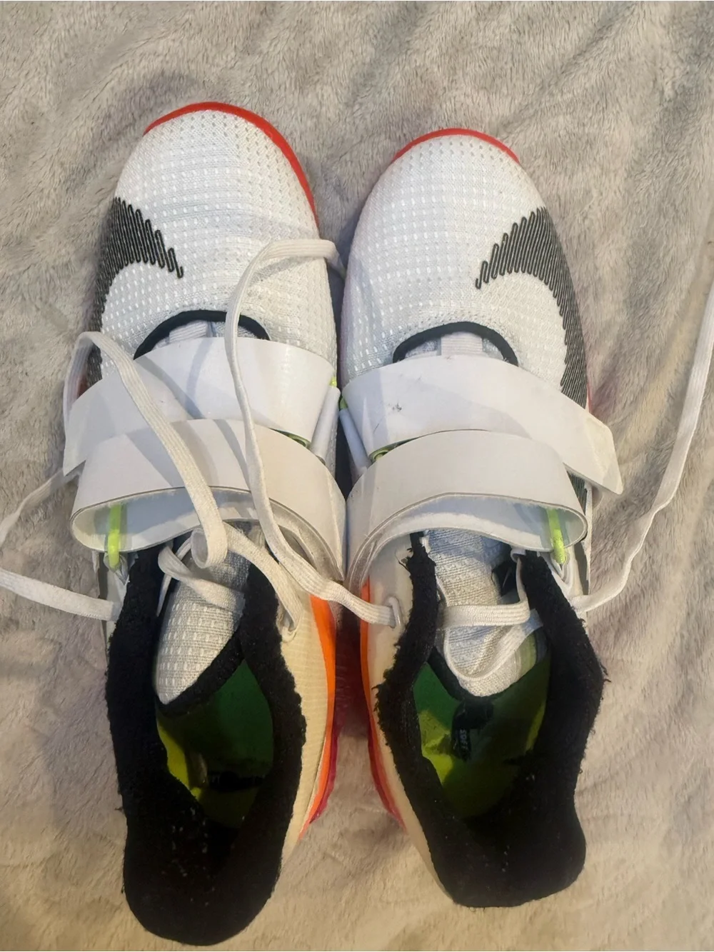 Nike White Athletic Shoes with Black Swoosh and Red Sole